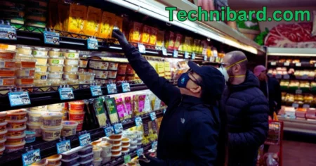 a person wearing a face mask and a black hat in a grocery store